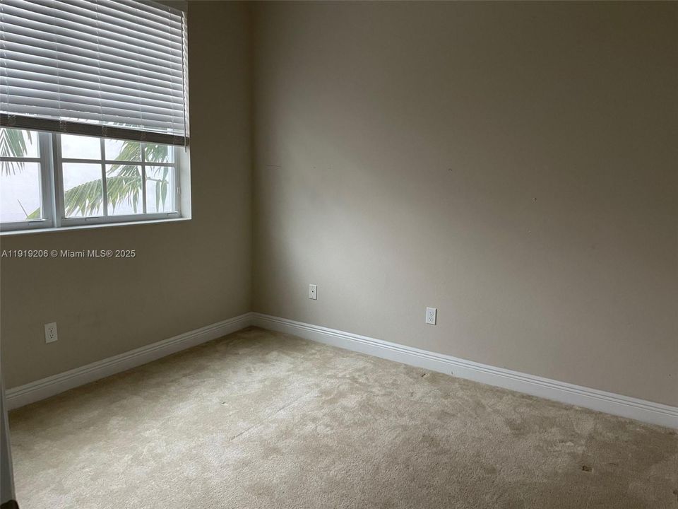 Carpeted Second Floor Bedroom