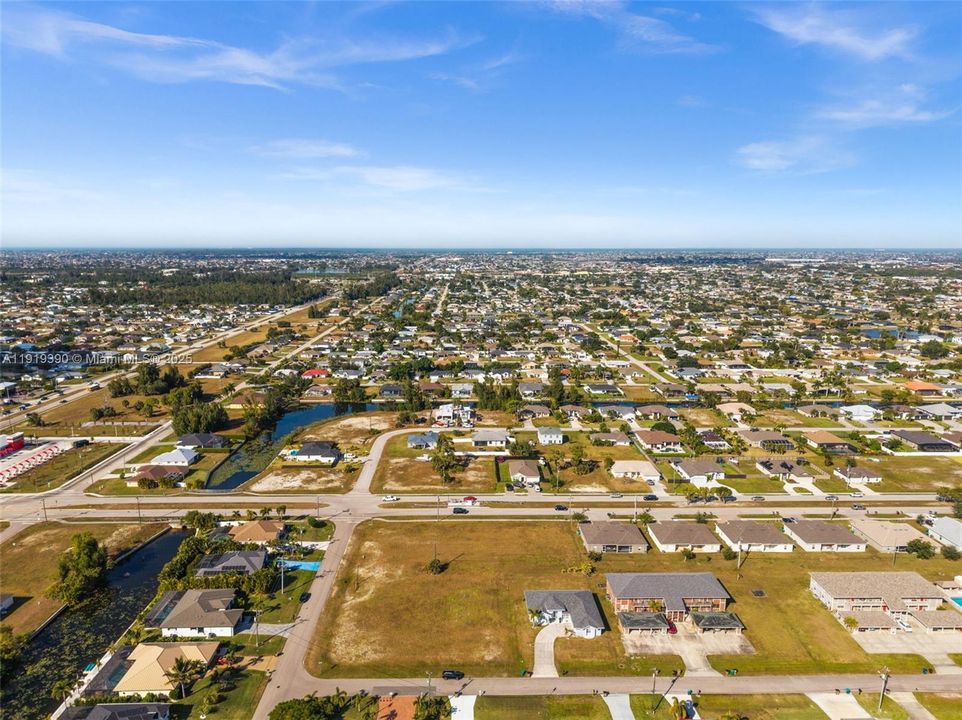 Multifamily-zoned site surrounded by well-kept homes.