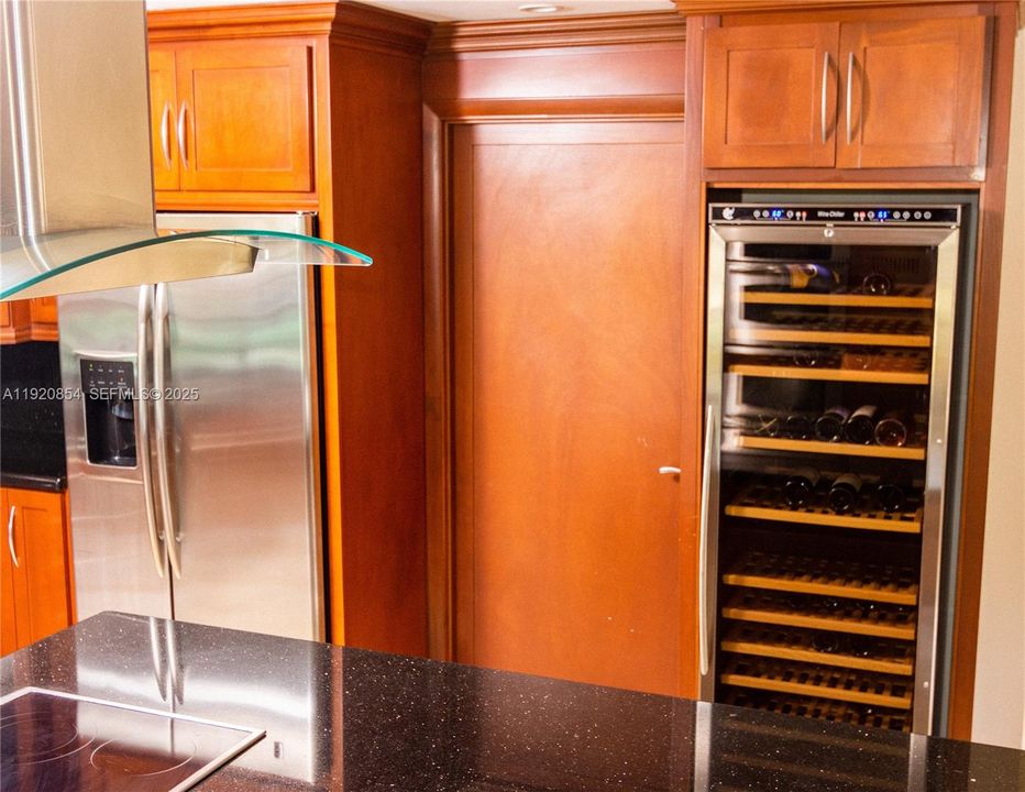 Wine refrigerator, and the door that leads to the laudry room.
