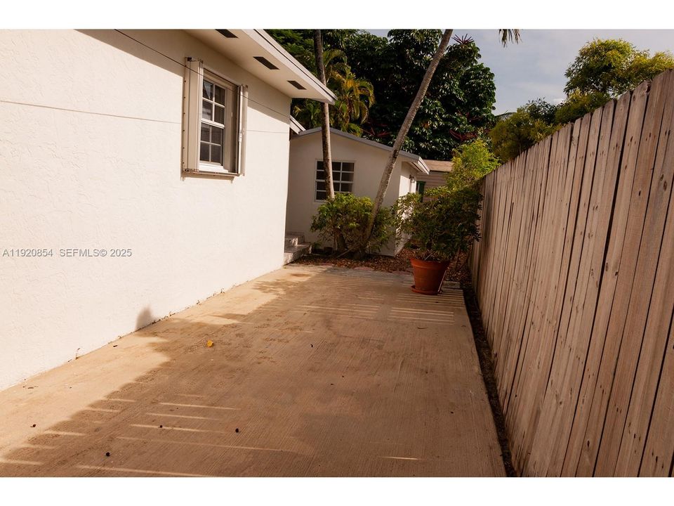 Past the right gate, there is plenty of space for a small boat, jet ski, or trailer.