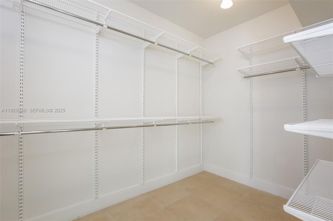 Primary Bedroom walk-in closet