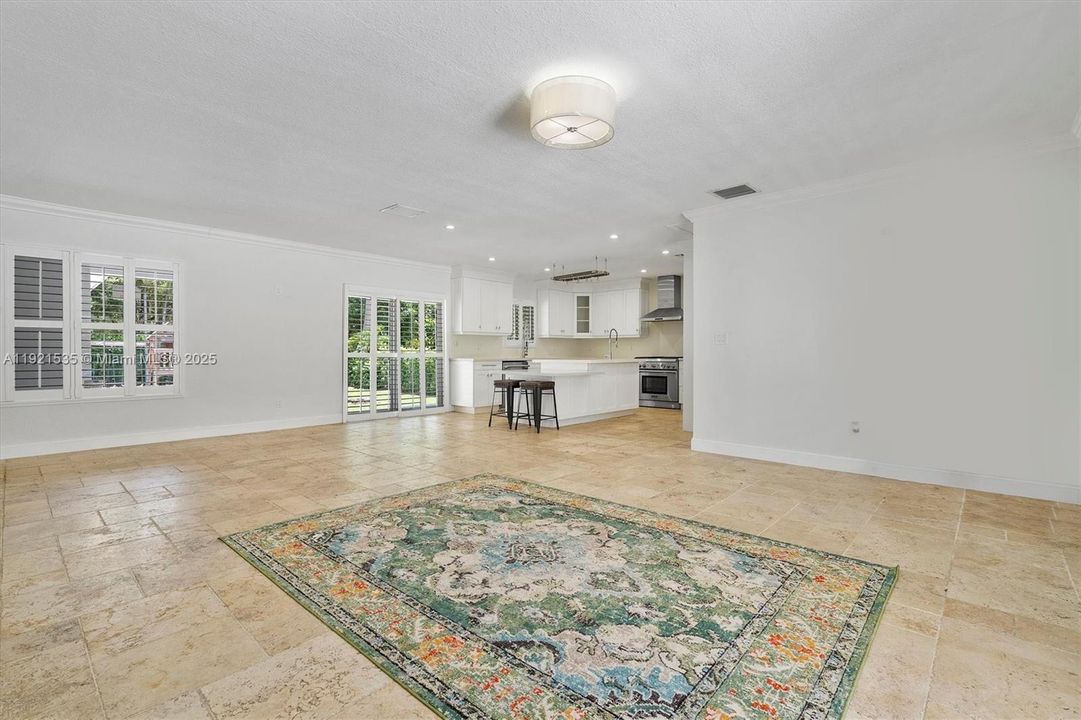 Spacious living room leading to the kitchen