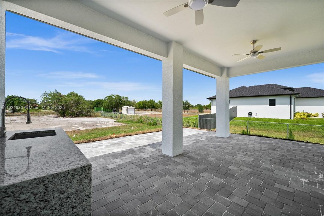 View of patio / terrace with a ceiling fan
