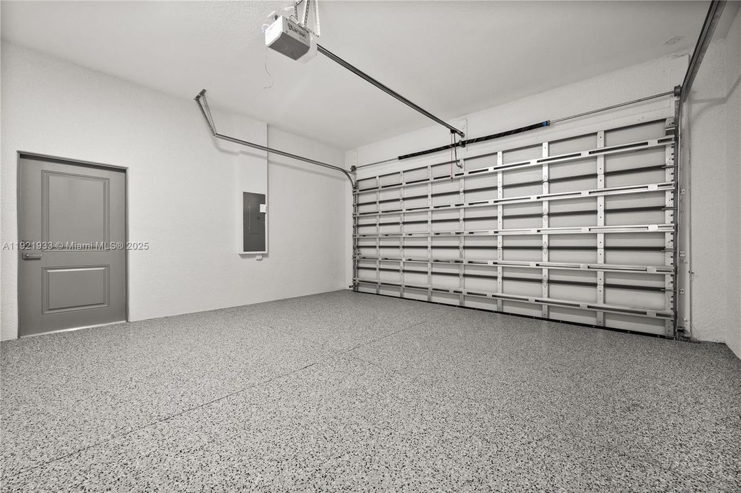 Garage with a garage door opener and electricpanel