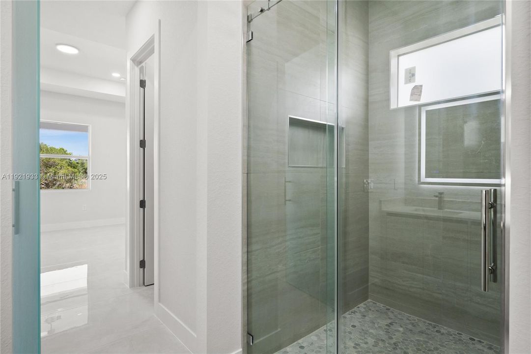 Full bathroom featuring a stall shower, vanity,and recessed lighting