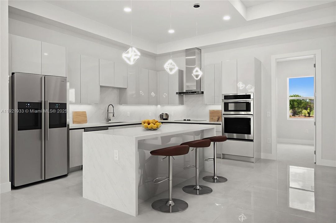 Kitchen with white cabinetry, modern cabinets,stainless steel appliances, a breakfast bar area,and hanging light fixtures