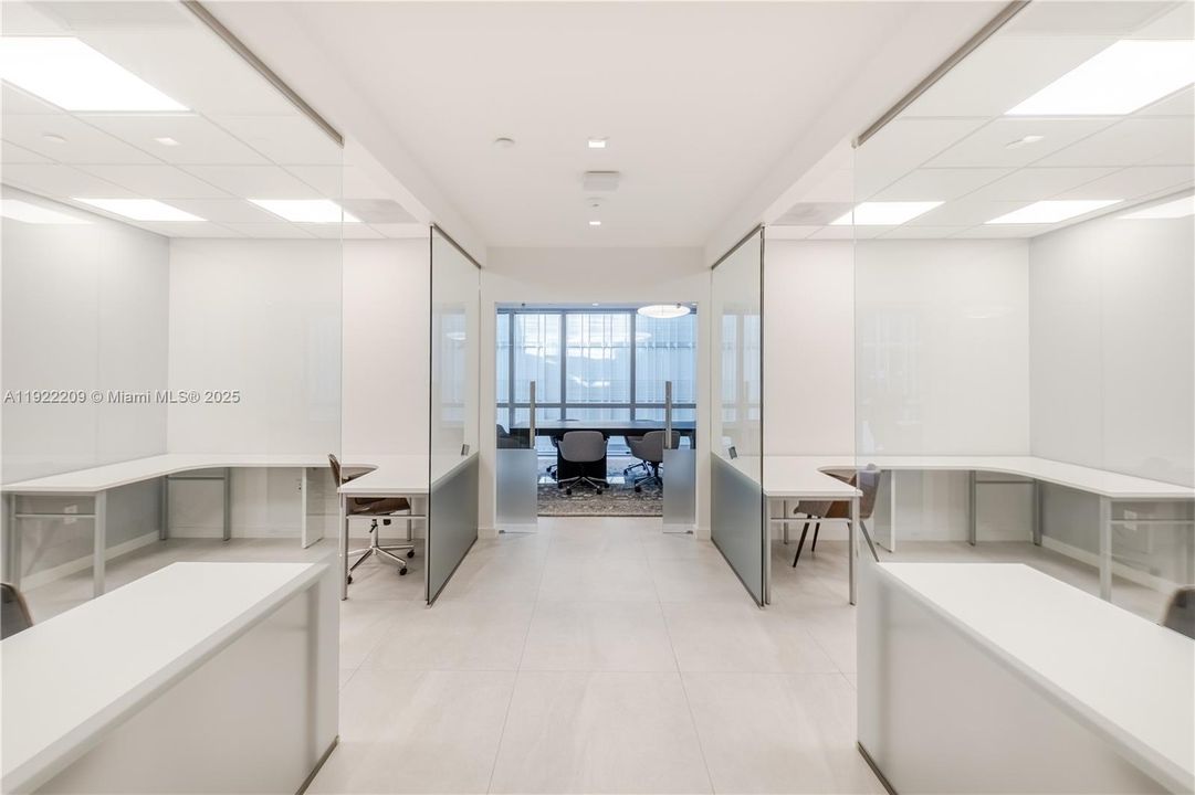 Business Center with Multiple Desks and Conference Room