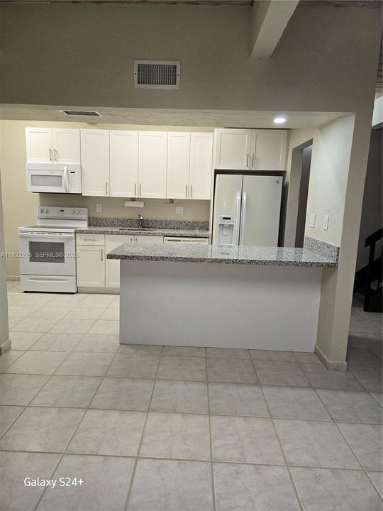 Open to dining area, granite counter top on