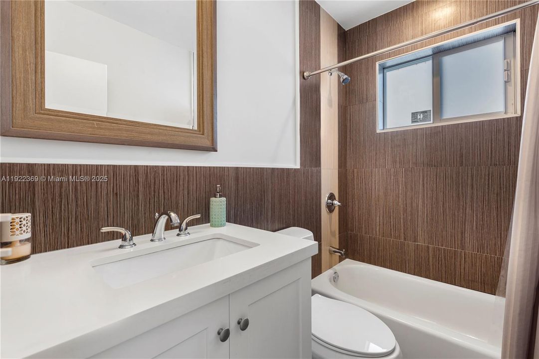 located between the 2 guest bedrooms