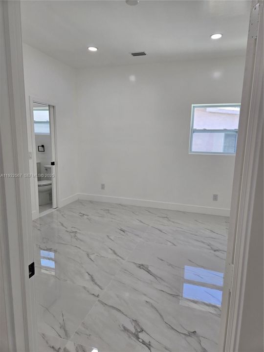 Entry Door to Left Wing Bedroom #2 facing side of the House