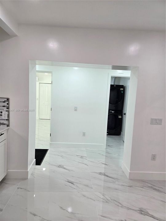 Off Kitchen access to Laundry Room and Master Bedroom