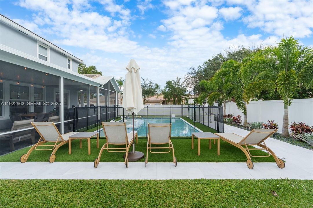 artificial turf surrounds pool