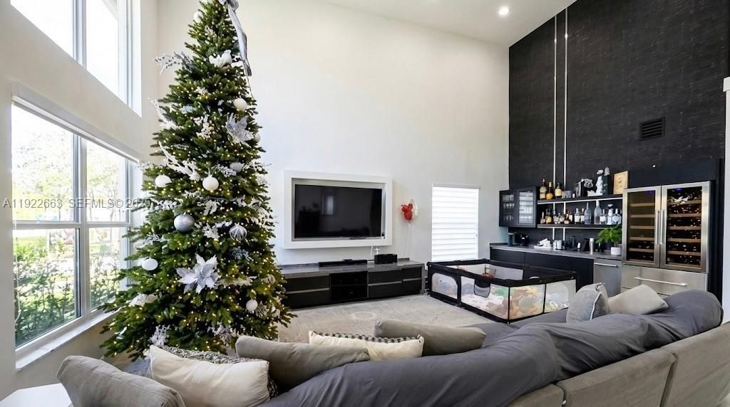 Expansive family / living room with built in bar