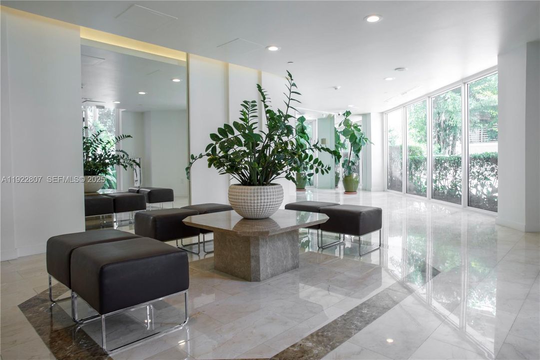 Elegant building lobby with modern décor, secure access, and a welcoming atmosphere—highlighting the community’s upscale feel.