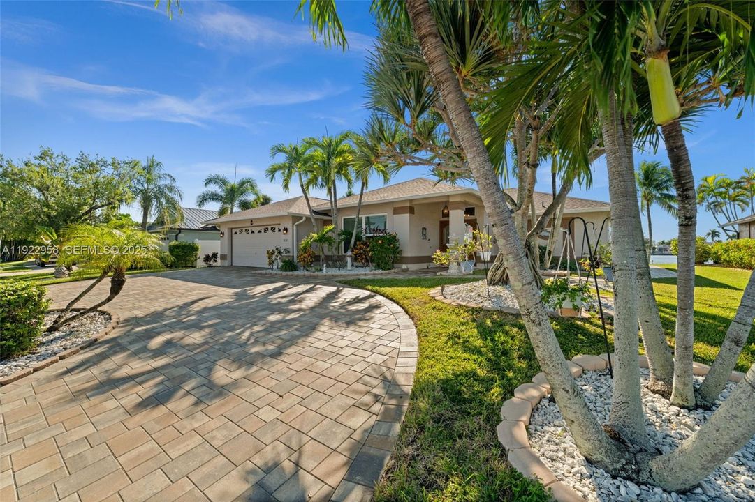 Large Circle Driveway and Tropical Landscaping