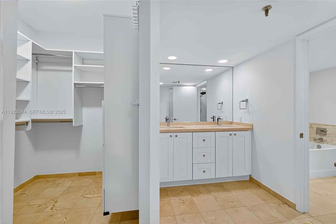Primary closet and bath with double sink