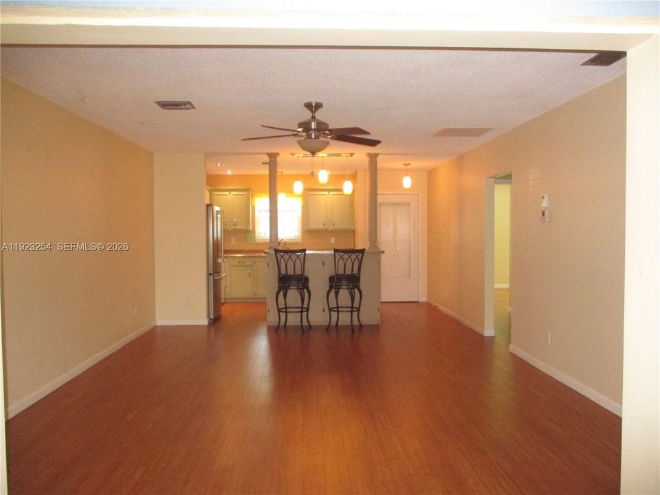 VIEW FROM PATIO INTO THE SPACIOUS LIVING/DINING AREA