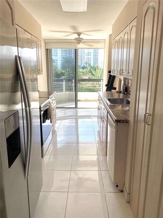 Kitchen opens to the balcony bringing lots of light