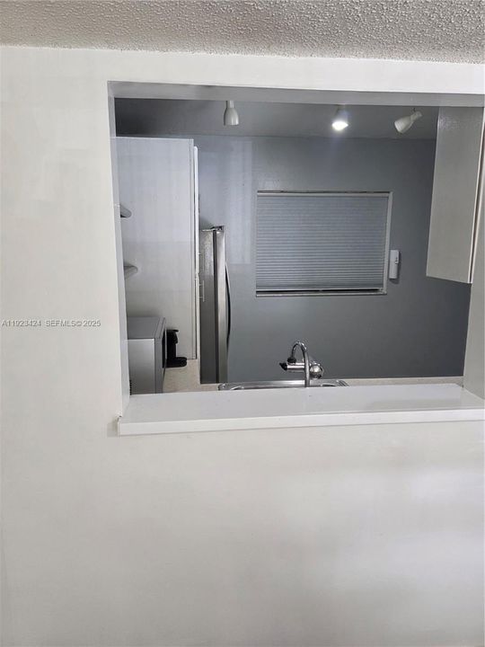 LARGER PASS THRU WINDOW TO DINING AREA