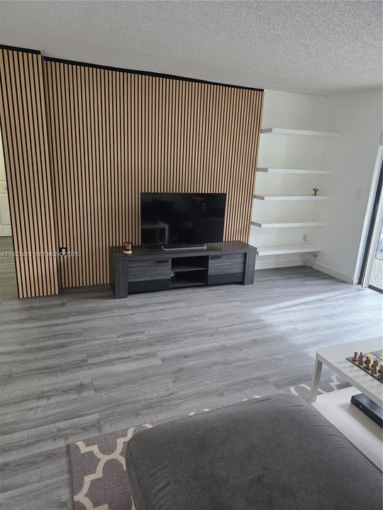 ACCENT WALL WITH SHELVES IN LIVING ROOM