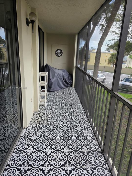 SCREENED BALCONY WITH STORAGE ROOM