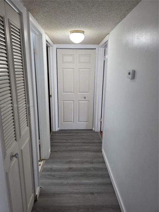 HALLWAY LEADING TO 2 BEDROOMS