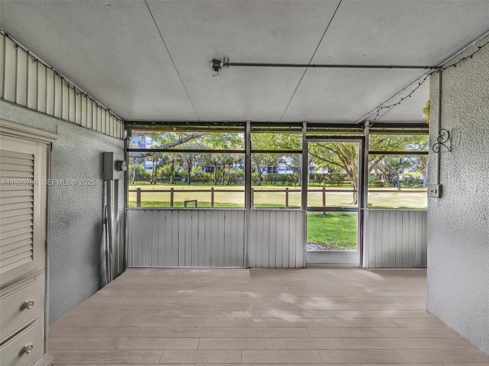 Screened Enclosed Patio, Expands the living area and opens to the Golf Course.