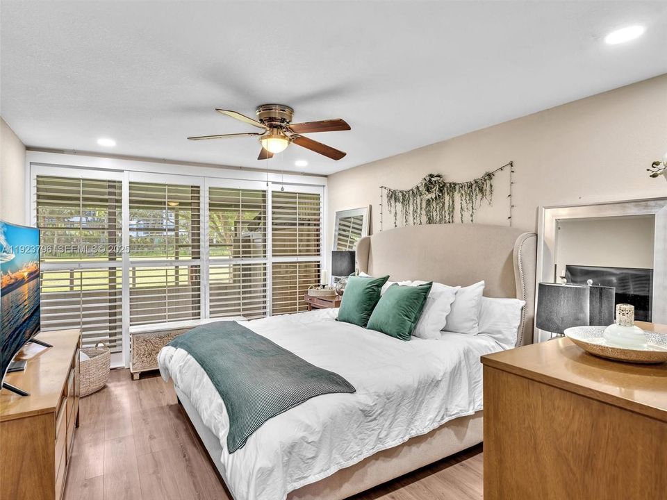 Primary Bedroom Opens to Screened patio to the Golf Course