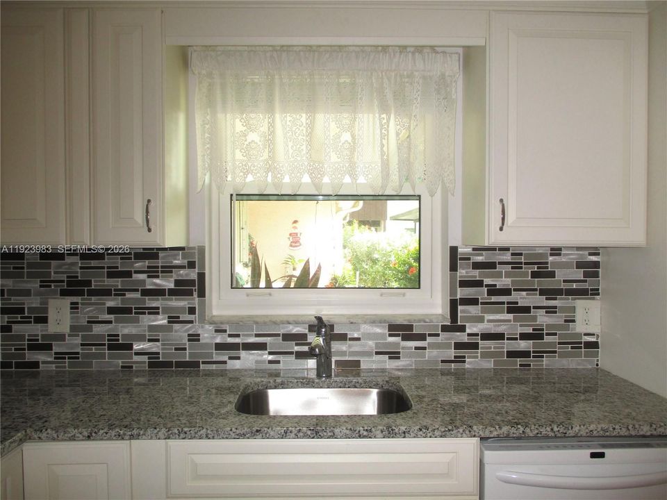SINGLE SINK WITH GARDEN WINDOW VIEW