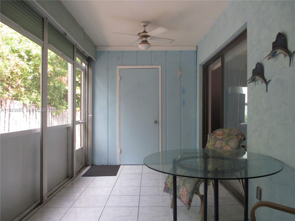 SCREENED SUNROOM WITH AN ADDED STORAGE ROOM