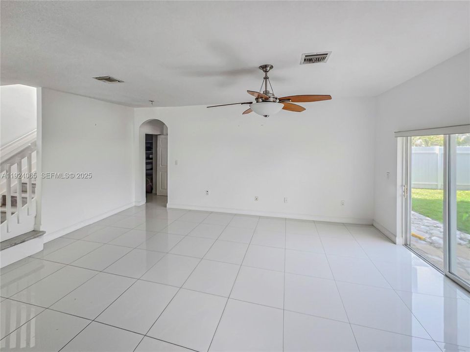 Overview of family area, access leading to first floor bedroom and bathroom.