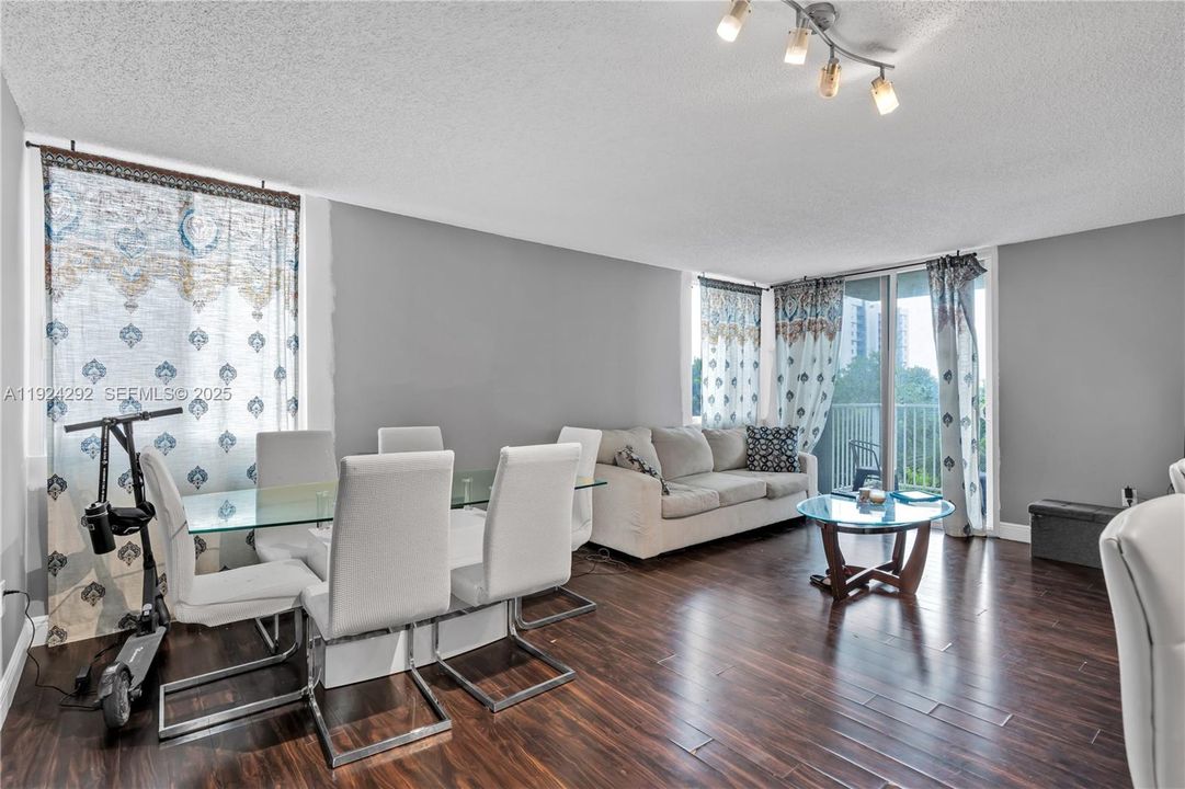 open living/dining area overlooking the balcony