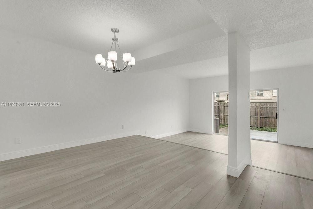 Dining space with updated flooring and lighting