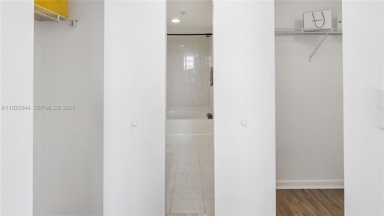 2 Closets in Primary Bedroom, to Right Full Walk in, to Left Semi Walk in