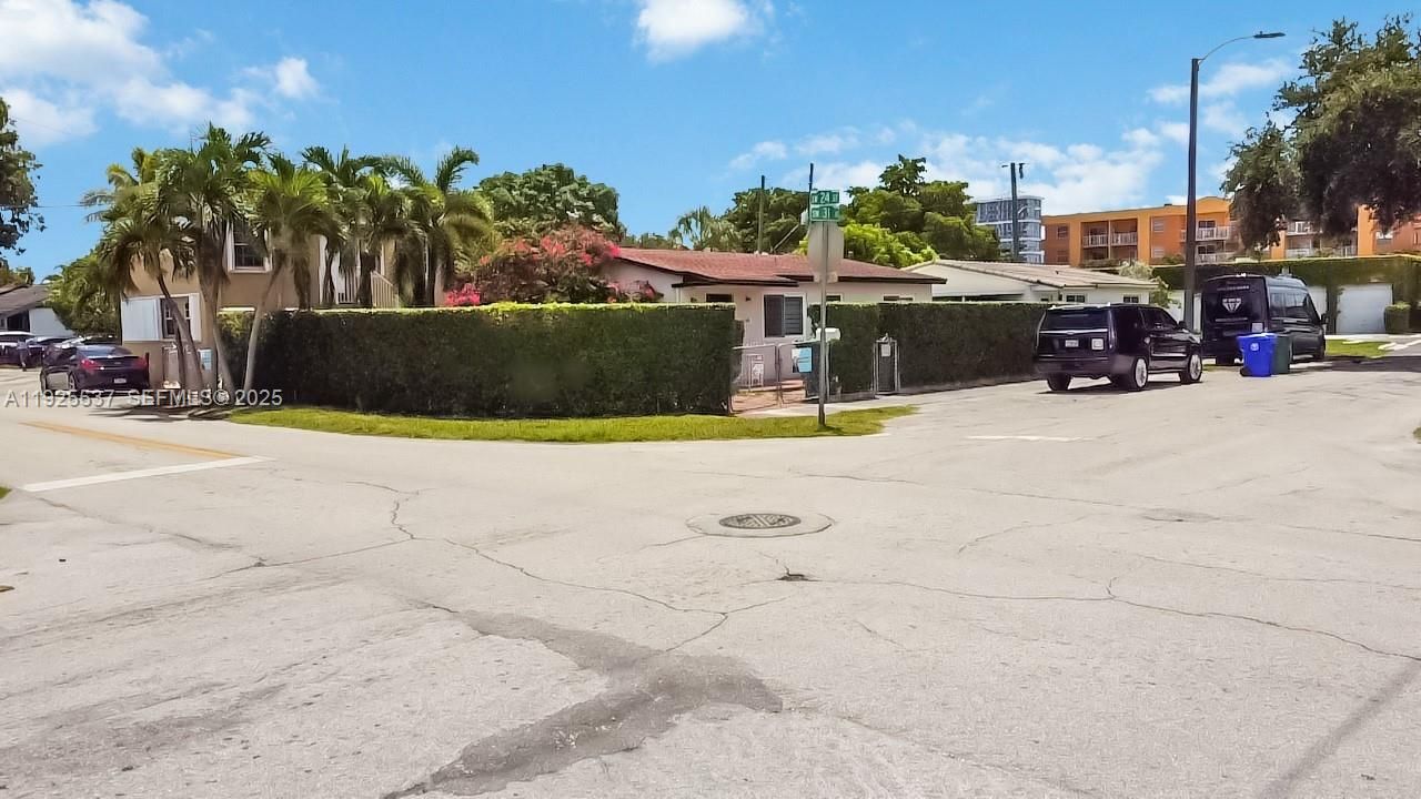 Home sits on a corner lot surrounded by lush vegetation offering a beautiful curb appeal and privacy