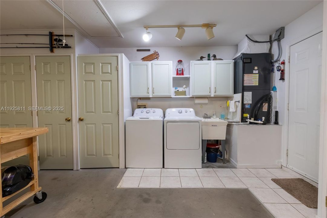 Newer washer & dryer with a laundry sink