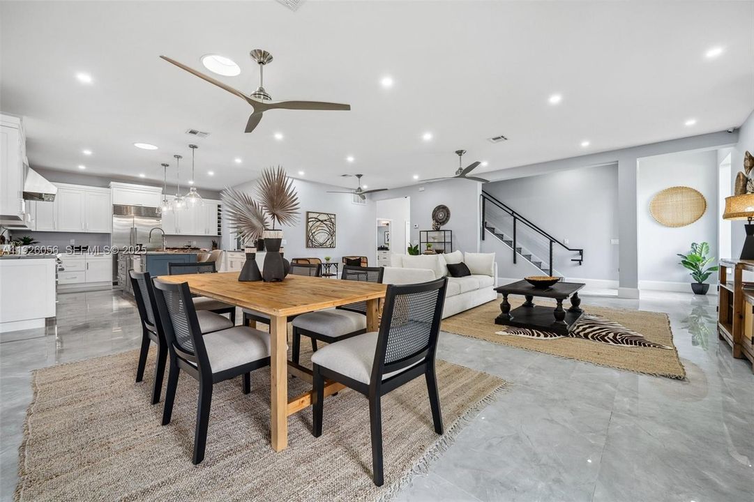 Dining area with kitchen and living room beyond