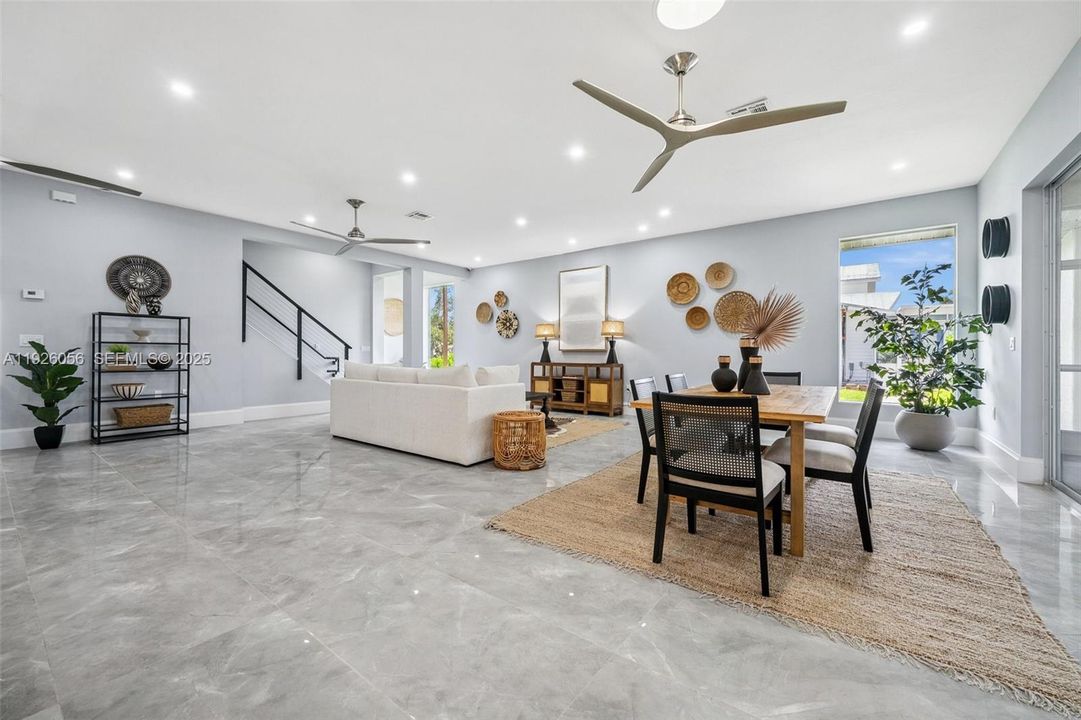 Recessed lights and modern fans throughout the main floor.