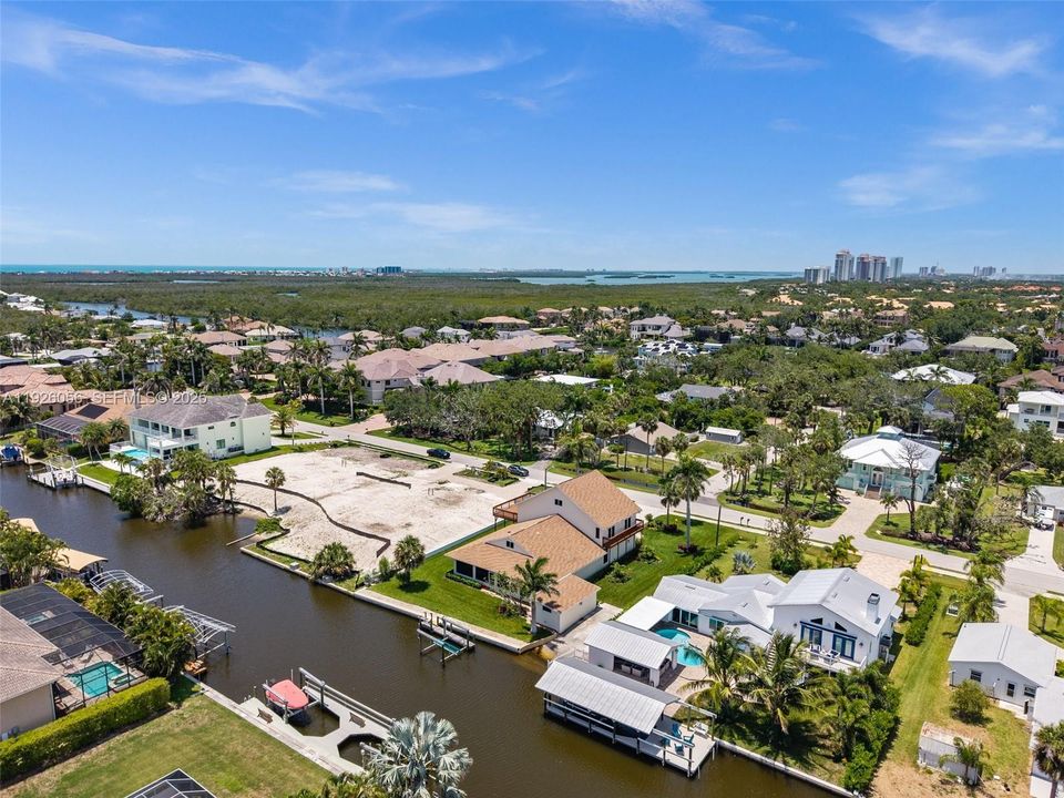 Rear Aerial View showing the Gulf Access Canal and Boat Dock
