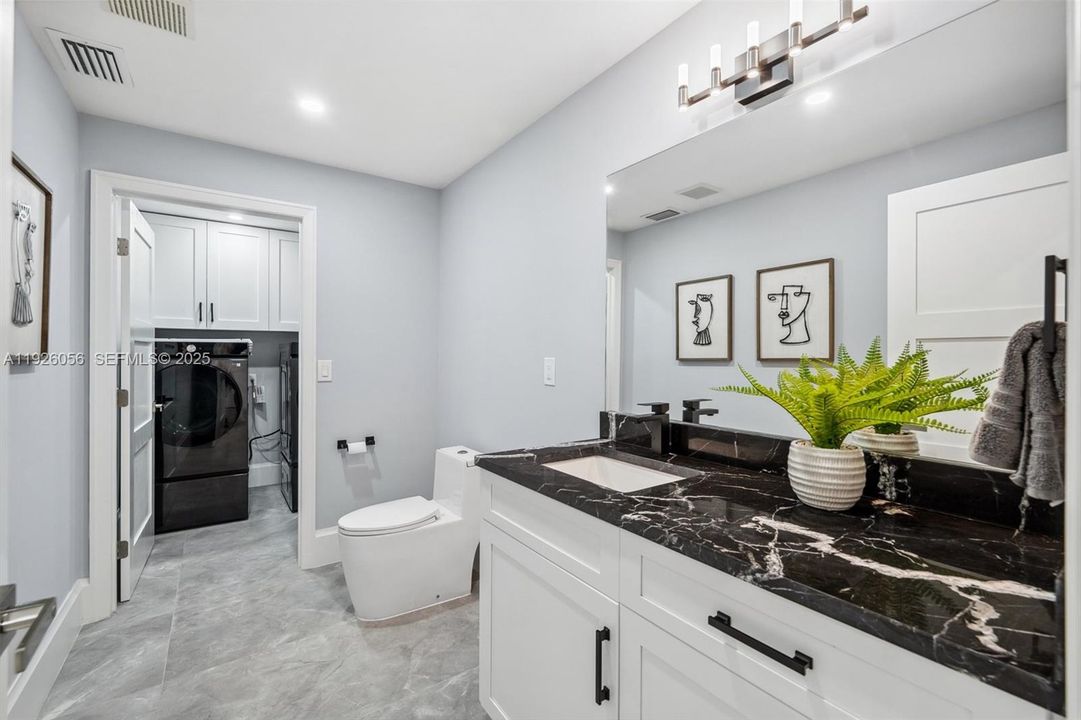 Main bathroom with Laundry room beyond