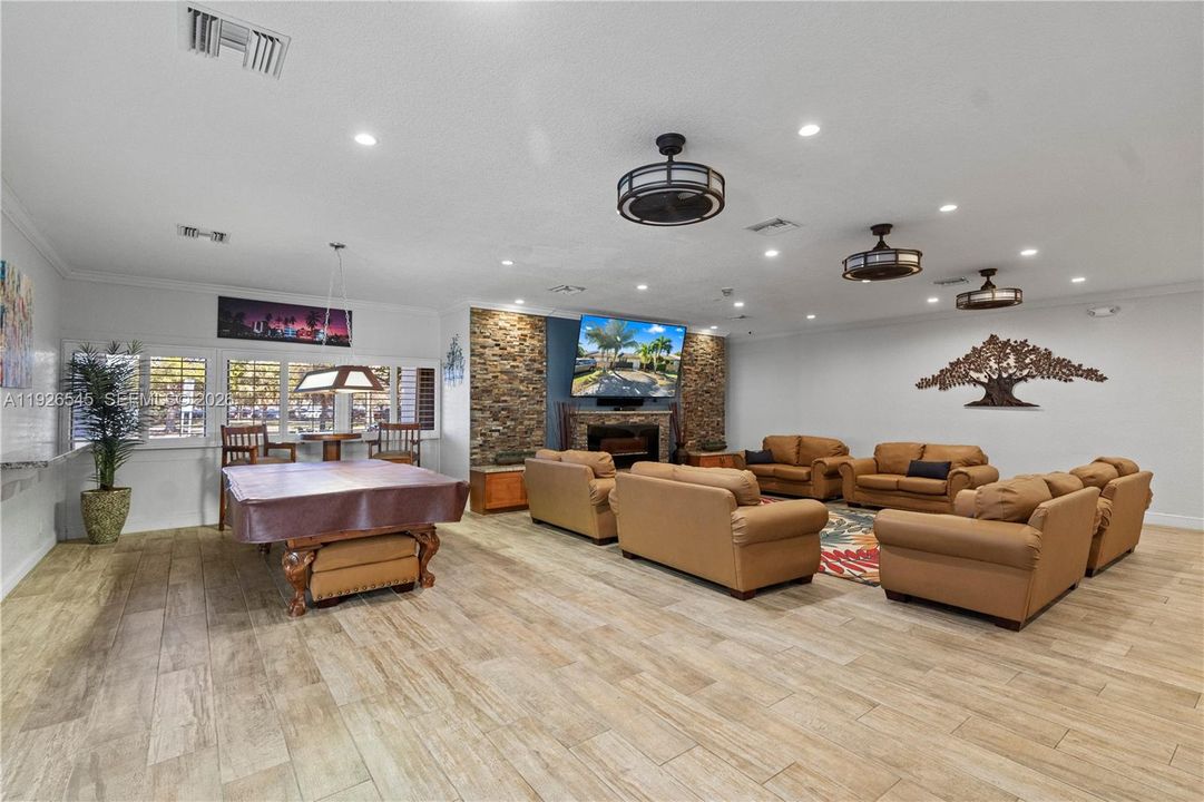Community amenities include a clubhouse room for billiards and TV time.