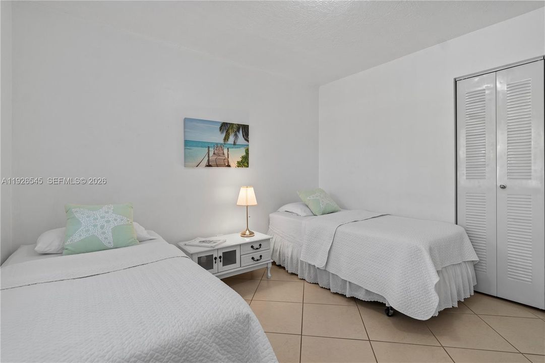 Spacious second bedroom with a wall-to-wall closet.