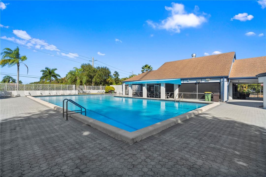 Community amenities include clubhouse access and a spacious pool area ideal for relaxing and entertaining.