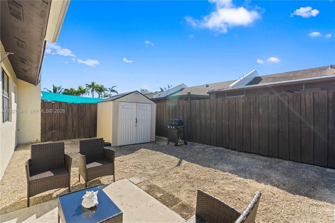 The patio is perfect for weekend BBQs, family gatherings, or your own tropical plant paradise, your space, your style.