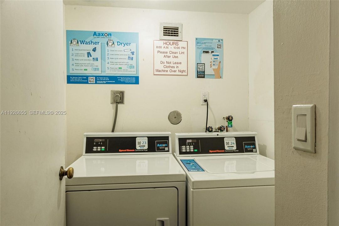 Laundry room right outside of unit's front door