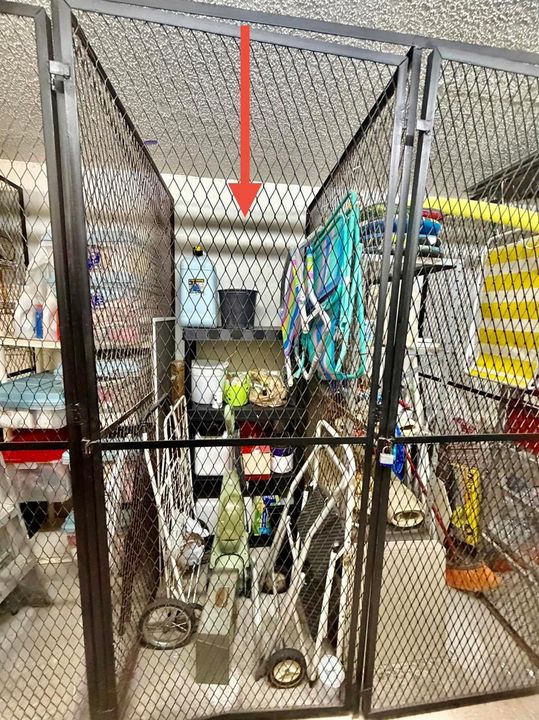 OUTSIDE STROAGE ROOM WITH CAGE