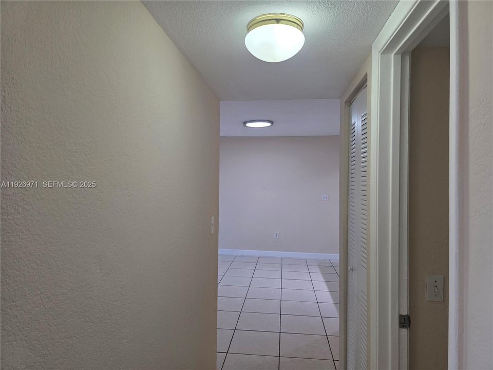 hall from rooms to dinning and living room.