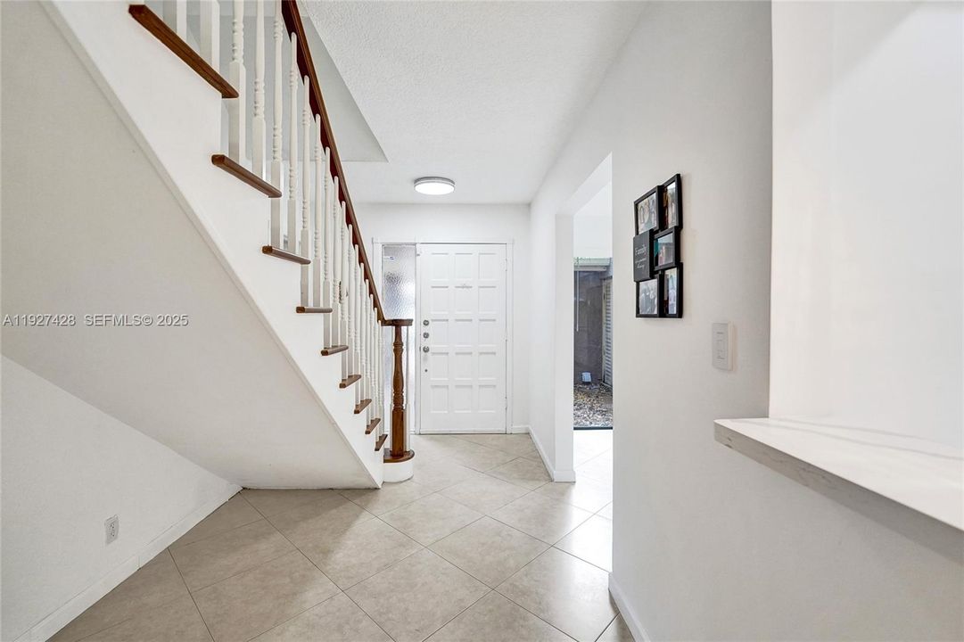 Many people use this as storage by closing the area under stairs.  Or simple some extra room for a small table and art