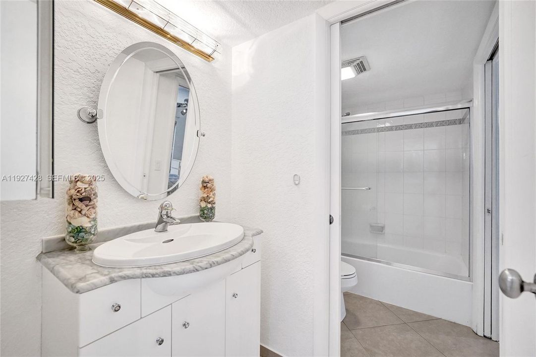 Full bath attached to downstairs bedroom.