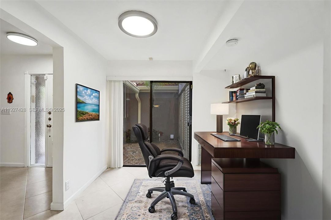 To the right of the entrance is a small room that also is very versatile.  Can be used as an office, small dining area separate from dining room or child's play room